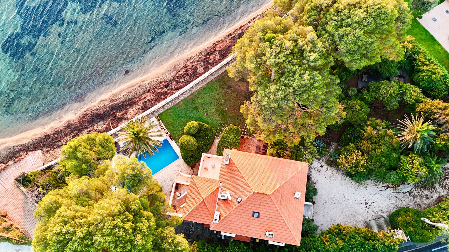 Aerial view of Villa Claudine, its swimming pool and waterfront garden